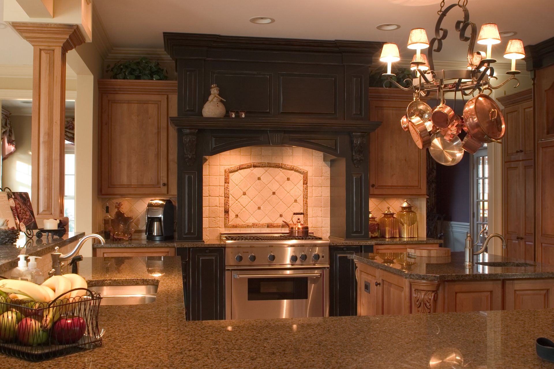 A kitchen with stainless steel appliances and granite counter tops